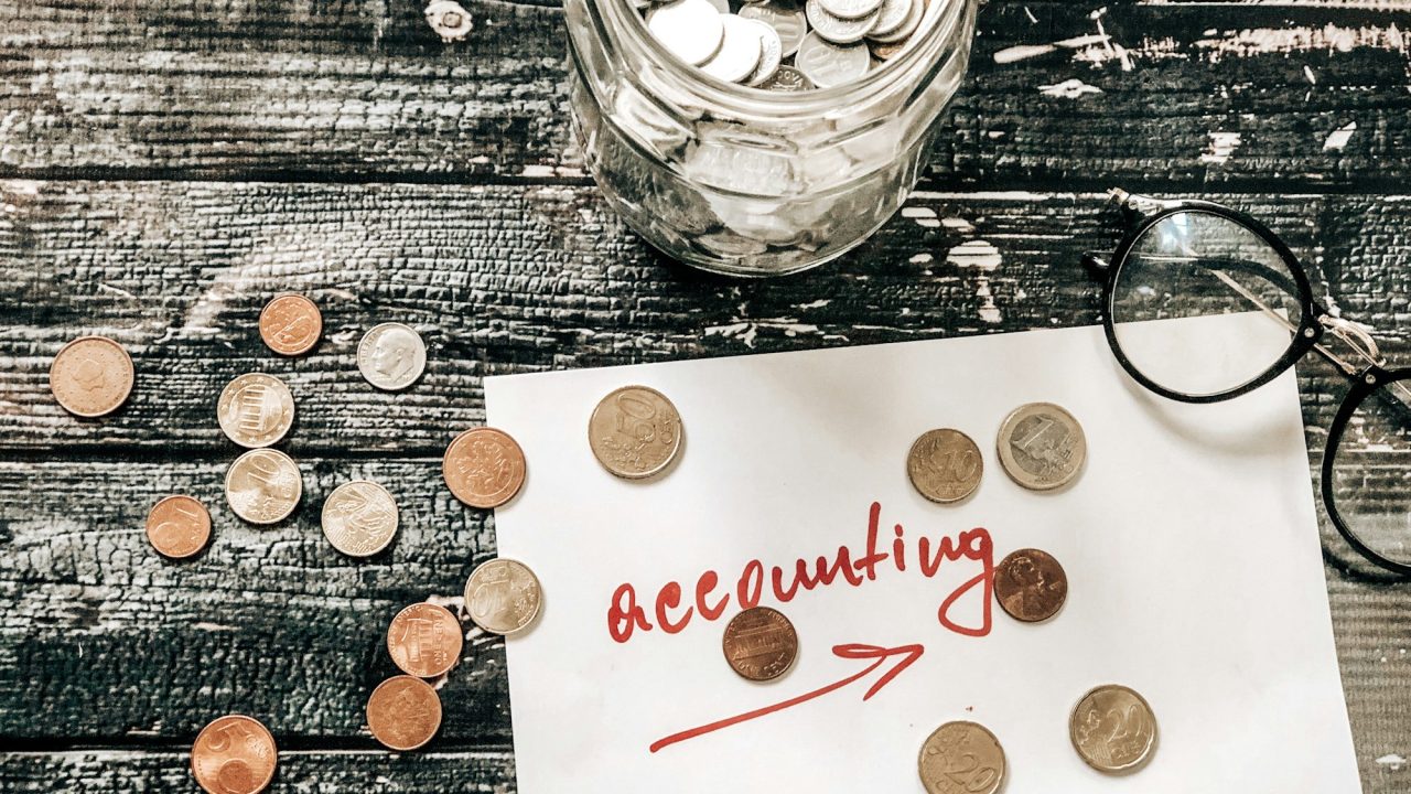 Accounting euro coins on table