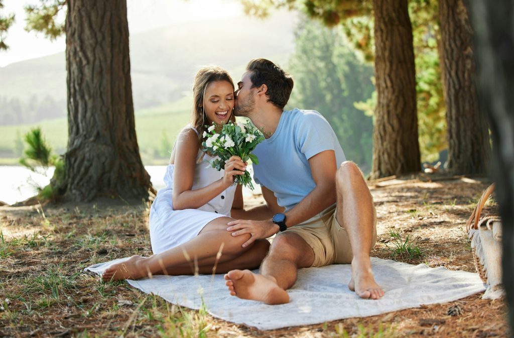 You deserve it and so much more. Shot of a young couple on a romantic date in the forest.
