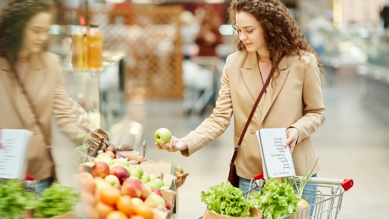 Young Woman Enjoying Grocery Shopping